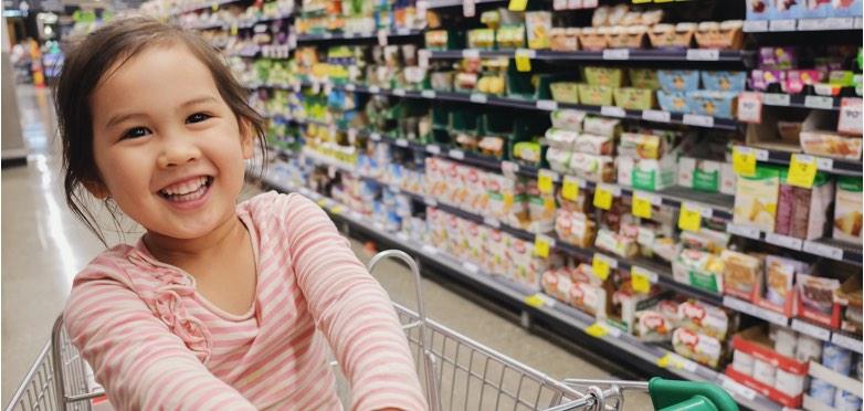 Girl in shopping trolley